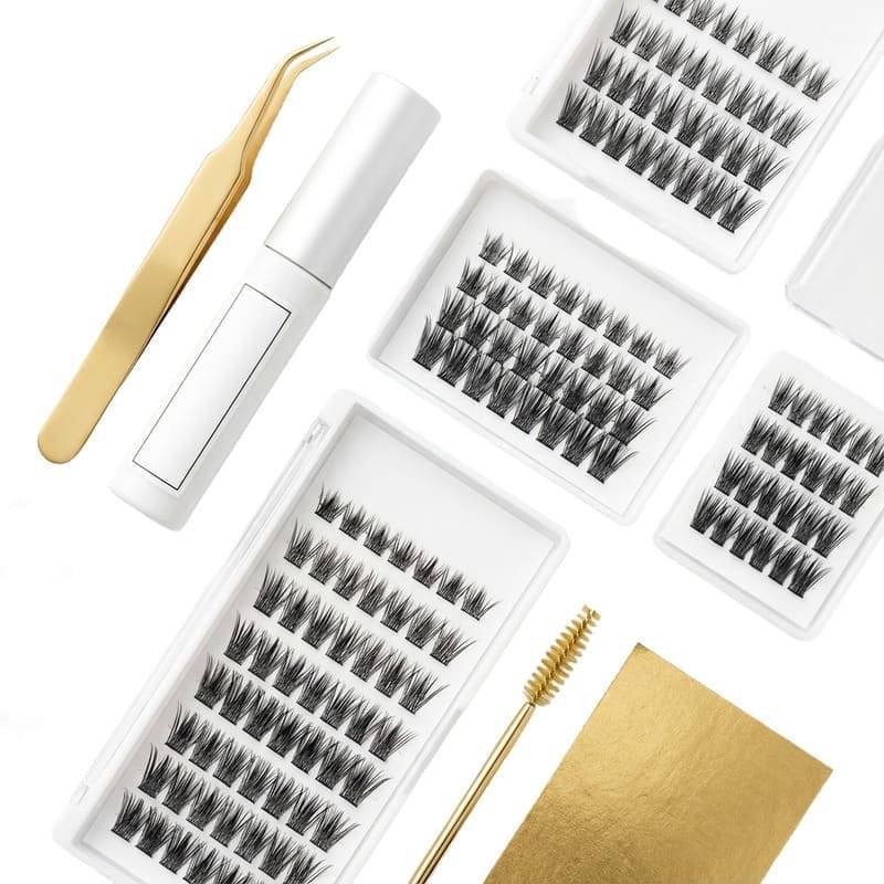 Complete DIY eyelash extension kit flat lay with gold tweezers, lash glue, and cluster lashes for private label - Cynthia Lashes